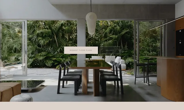 A render of the open dining room — a long timber table, concrete ceiling, glass walls onto the garden — with two small outlined buttons over it, Request Floor Plans and Gallery
