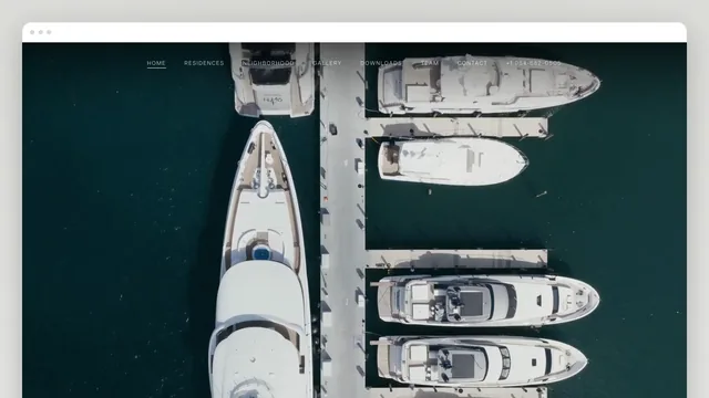 The Selva House home page in a browser window: a full-bleed aerial film of yachts moored along a dock in dark green water, with a thin nav across the top — Home, Residences, Neighborhood, Gallery, Downloads, Team, Contact