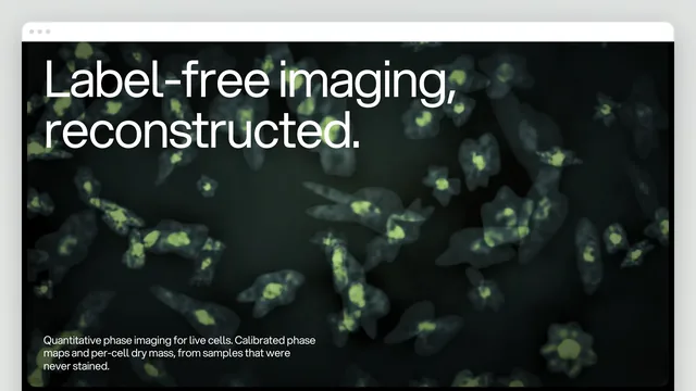The Velos Bio home page in a browser window: a near-black dark-field hero of live cells — grey-green bodies, glowing yellow-green nuclei — with the heading "Label-free imaging, reconstructed." and "Quantitative phase imaging for live cells. Calibrated phase maps and per-cell dry mass, from samples that were never stained."